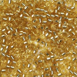 TOHO-perler runde 11/0 – klar topas, 22 Silver lined light topaz